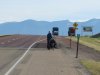 PJ walking his bike with flat tire to the truckers who were going to help us.